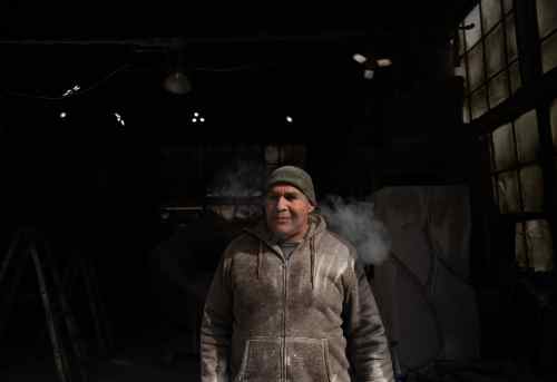 Artist Jason Quigno stands in his studio